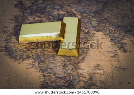 Golden bar on vintage map on background.