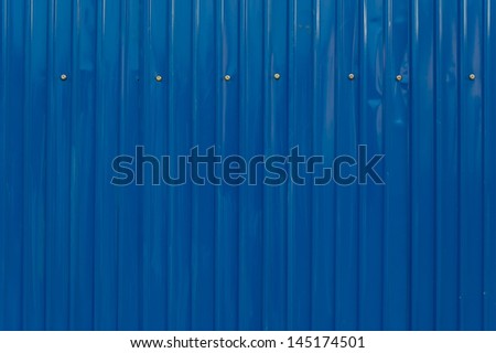 Blue color corrugated metal sheet as background Royalty-Free Stock Photo #145174501