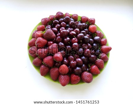 Green dish, strawberry, sweet cherry, fruit, summer Royalty-Free Stock Photo #1451761253