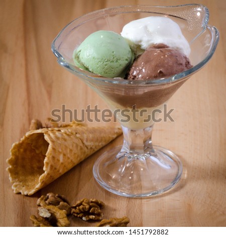 ice cream balls in a glass ice-cream bowl