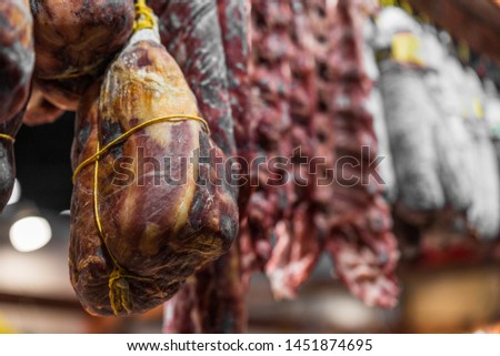 Traditional Italian delicatessen salami and other sausage, on display at a street food market fair festival