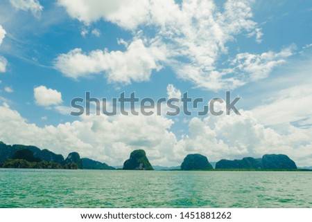 Cumulus clouds over the ocean and island is quiet in sea south Thailand,Phang Nga