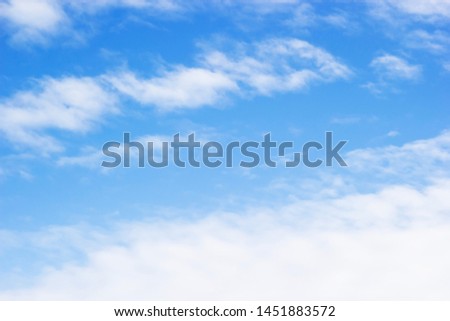 Blue sky background and soft white clouds, copy space.