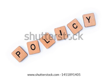 The word POLICY, spelt with wooden letter tiles over a plain white background.