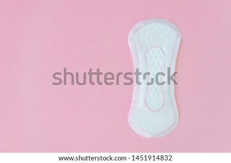 Daily women's  gasket on pink background. copy space. soft focus.