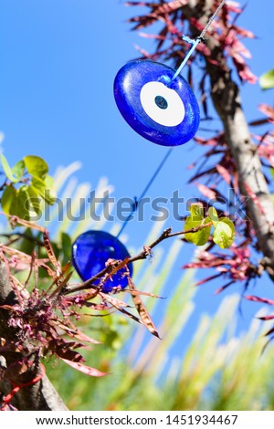Amulet evil eye will protect from troubles and unhappiness hanging in the branches of trees. Turkey