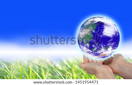 Hands that gently wrap the earth (An image of environmental protection)