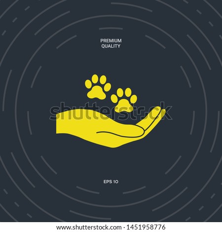 Hand holding paw symbol. Animal protection. Graphic elements for your design