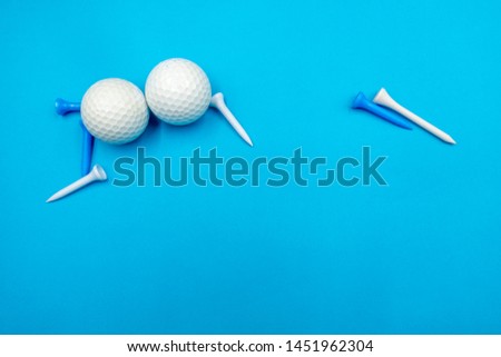 Golf balls are on blue background