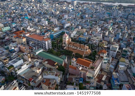 Aerial photography of Catholic Church,rooftops, architecture and view to Port and River Ho Chi Minh City Vietnam