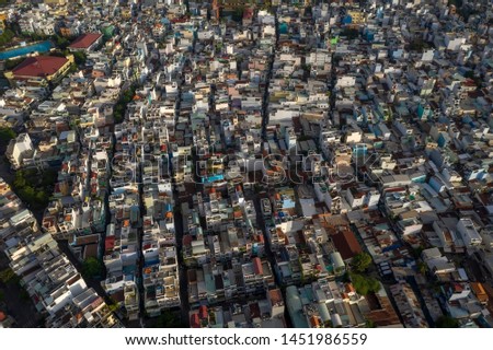 Aerial photography of rooftops, high density residential architecture mainly the typical stle of terrace house or town house. Ho Chi Minh City is the largest and most developed City Vietnam