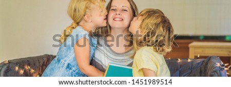 Teacher, tutor for home schooling Boy and girl at the table. Or mother, daughter and son. Homeschooling BANNER, LONG FORMAT