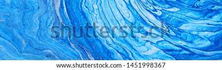 photography of abstract marbleized effect background. Blue and white creative colors. Beautiful paint. banner