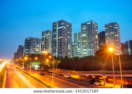 Light trails on the street at Beijing Central Business district at night in Beijing ,China.