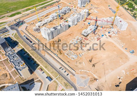 aerial view of new residential area with multistory modern apartment buildings under construction
