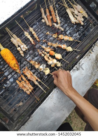 seafood bbq and meat skewer on grill