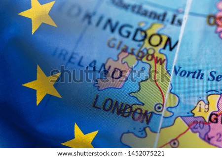 Selective focus to the United Kingdom on a world globe composited with the European flag in a concept of Brexit