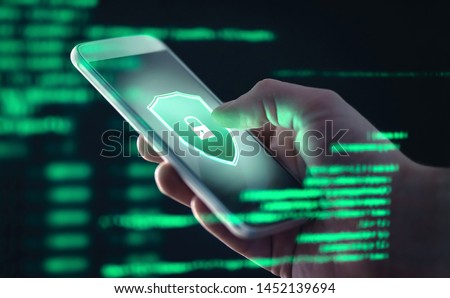 Mobile phone personal data and cyber security threat concept. Cellphone fraud. Smartphone hacked with illegal spyware, ransomware or trojan software. Hacker doing online scam. Antivirus error. Royalty-Free Stock Photo #1452139694