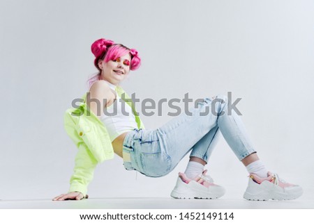 woman with pink hair crouched fashion studio