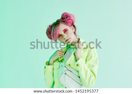 woman with pink hair with a white bag portrait