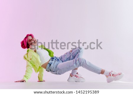 woman with pink hair sat on the floor fashion retro