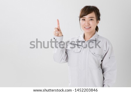 Gesture of the woman in work clothes