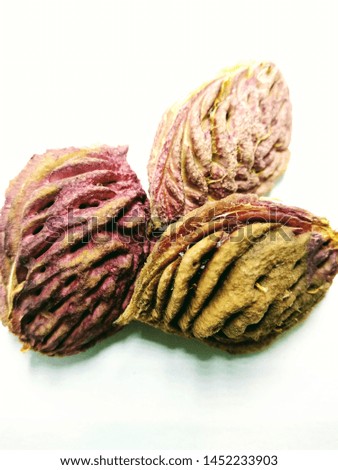  A portrait picture of peach seed's on white background