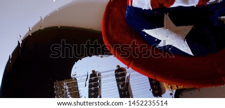 electric guitar and color hat . closeup