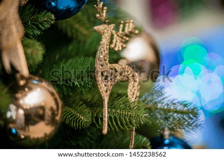Christmas toy on the Christmas tree, close-up, space for text