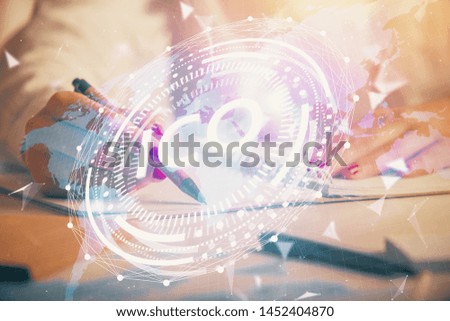 Cryptocurrency hologram over woman's hands writing background. Concept of blockchain. Double exposure