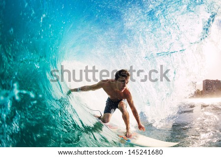 Surfer on Blue Ocean Wave Getting Barreled Royalty-Free Stock Photo #145241680