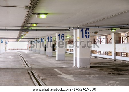 Indoor multi level empty parking lot with perspective in shopping mall.