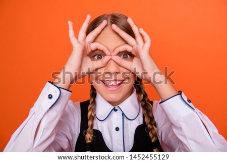 Close-up portrait of her she nice attractive lovely cheerful cheery glad foolish comic pre-teen girl showing double two ok-sign like specs isolated over bright vivid shine orange background