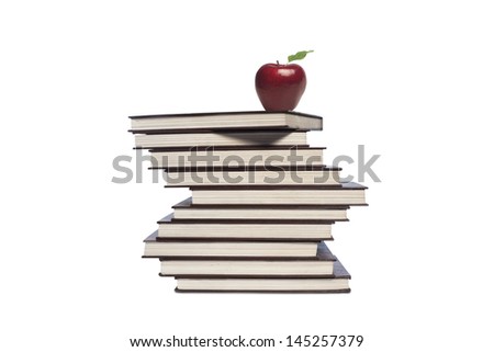 Picture of apple and pile of books on white background