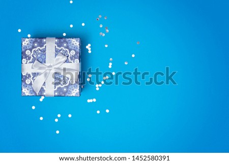 Gift box on a blue festive background