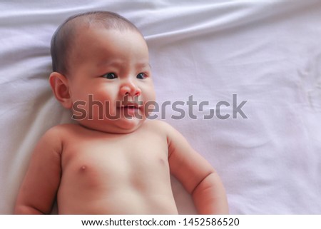 asian baby girl in bed room
