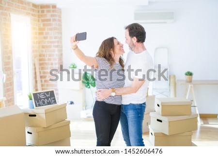 Middle age senior romantic couple taking a selfie picture with s