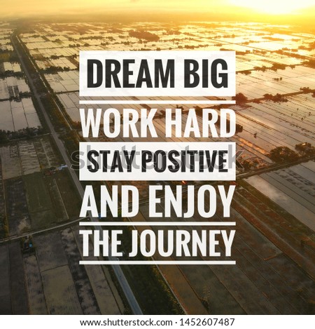Inspirational motivation quote on aerial sunrise background. Dream big work hard stay positive and enjoy the journey. 