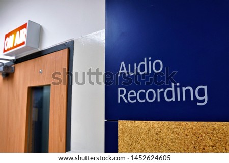 Closeup of wall that have letters  "audio Recording".