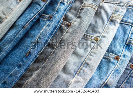 denim blue jeans stack texture background closeup