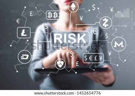 Cryptocurrency risk theme with business woman using a tablet computer
