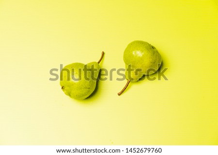 Green pears on a light green background