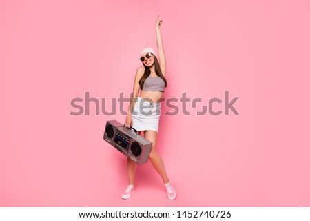 Ful size photo of cute charming lady dancing showing index finger up wearing eyeglasses eyewear isolated over pink background