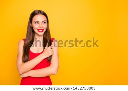 Photo of attractive lady bright look indicating fingers empty space advising cool sale discount wear red swimming suit isolated yellow background
