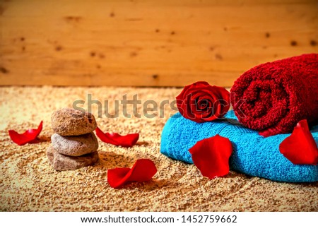 Wellness - towels on sand and stone poplar