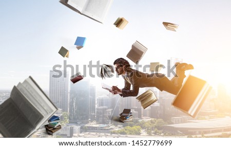 Joyful happe businessman levitating horizontally