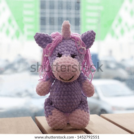 Crocheted amigurumi unicorn. Knitted handmade toy.