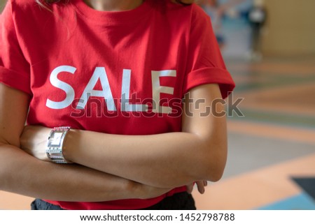 Sale shopping text on red casual shirt.Discount promotion announcement for customer.