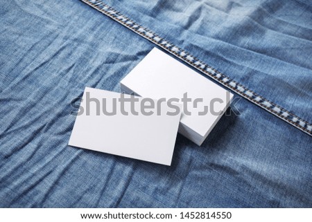 Blank business cards template on denim background. For graphic designers portfolios.