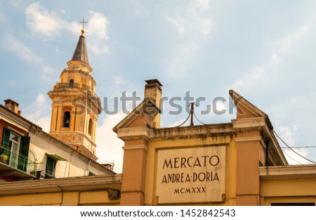 Close-up of the sign of Mercato Andrea Doria, an old roofed market selling local products in the ancient fishing borough of Oneglia, Imperia, Liguria, Italy